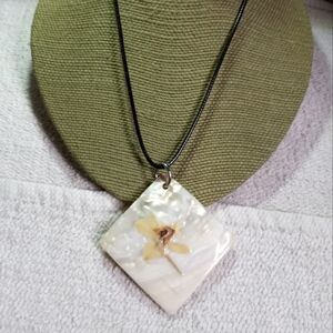 Large shell pendant with painted flower 🌸 on black cord necklace